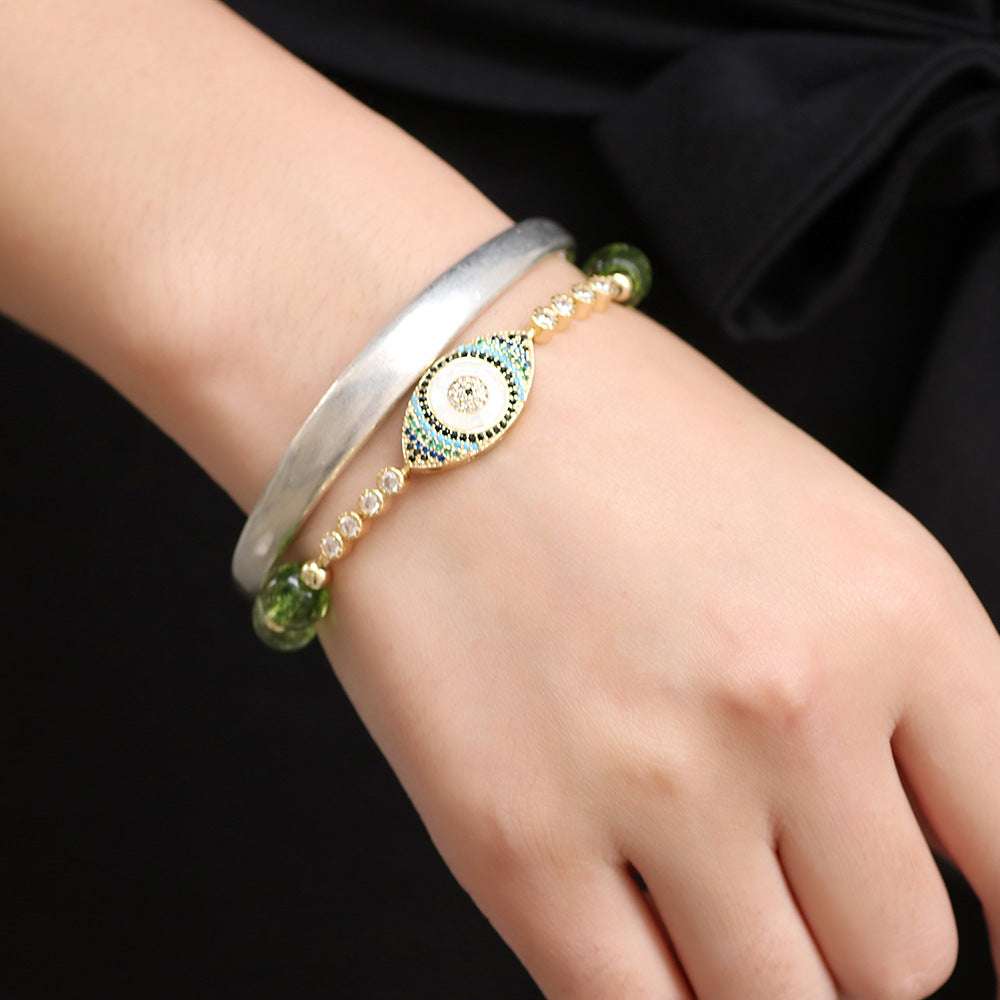 green peridot gemstone bracelet with evil eye charm