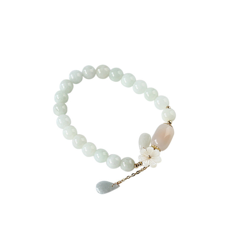 Natural A grade jade beads with shell flower centerpiece
