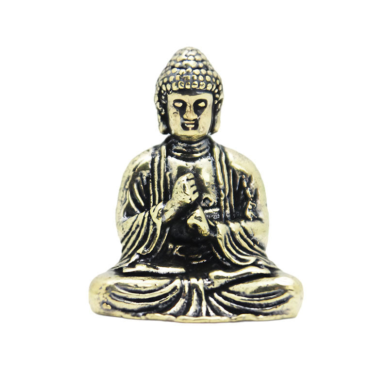 Mini pure copper Buddha statue on white background