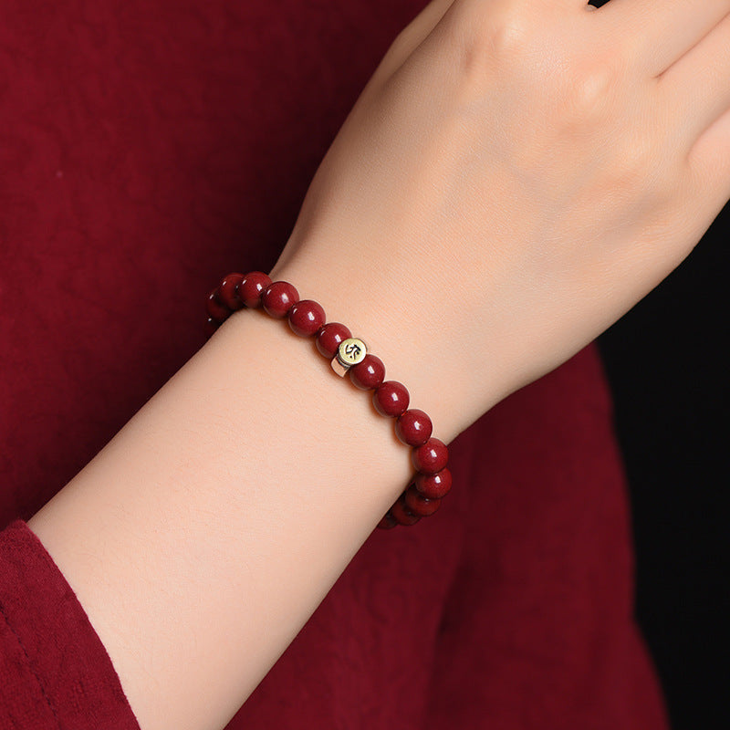 cinnabar beads bracelet with zodiac sign charm in sterling silver