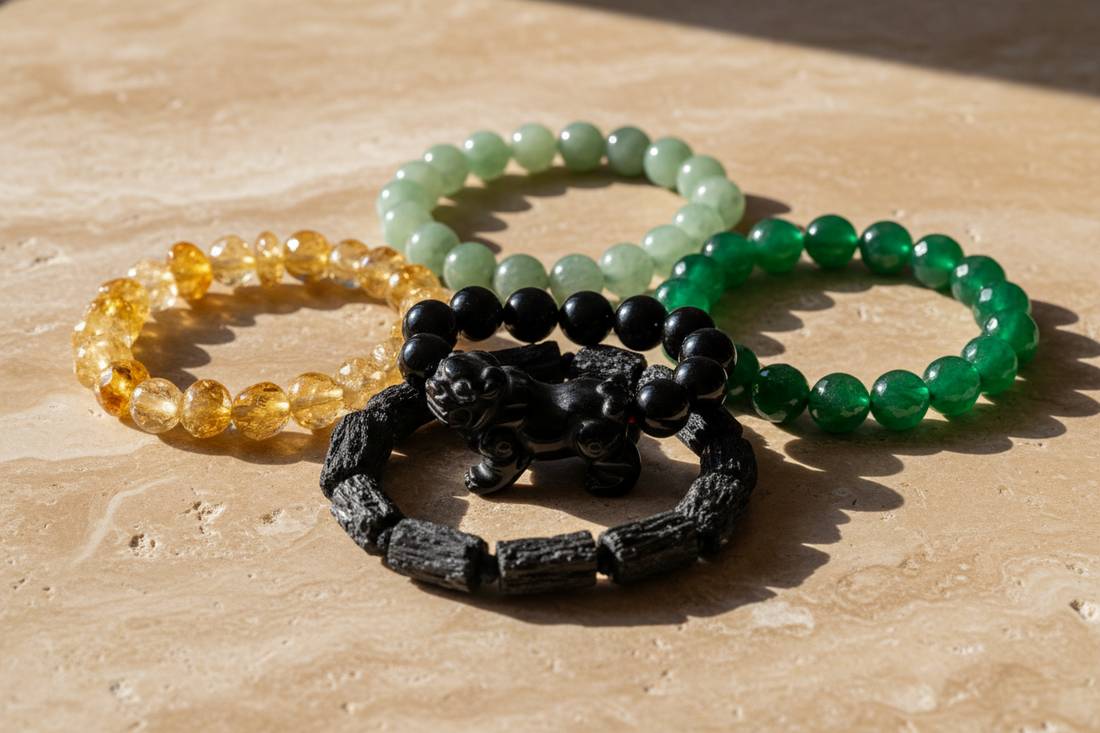 Different natural Feng Shui bracelets including black obsidian Pixiu, jade, citrine, aventurine and black tourmaline