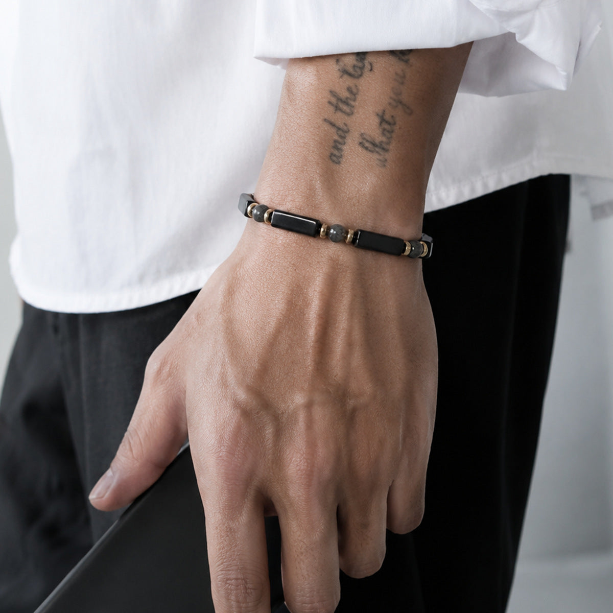 Man Wearing Black Agate and Larvikite Bracelet