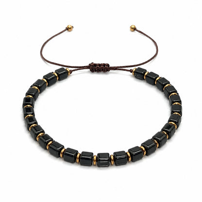 Black obsidian bracelet for men featuring square cube bead design on a white background