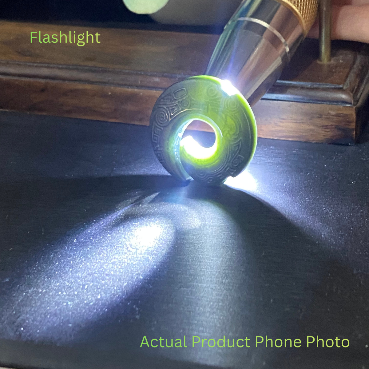 Full Translucent natural nephrite jade pendant illuminated by flashlight