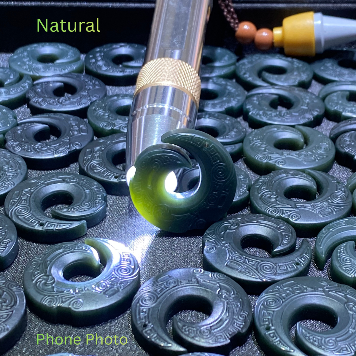 partial Translucent natural nephrite jade pendant illuminated by flashlight