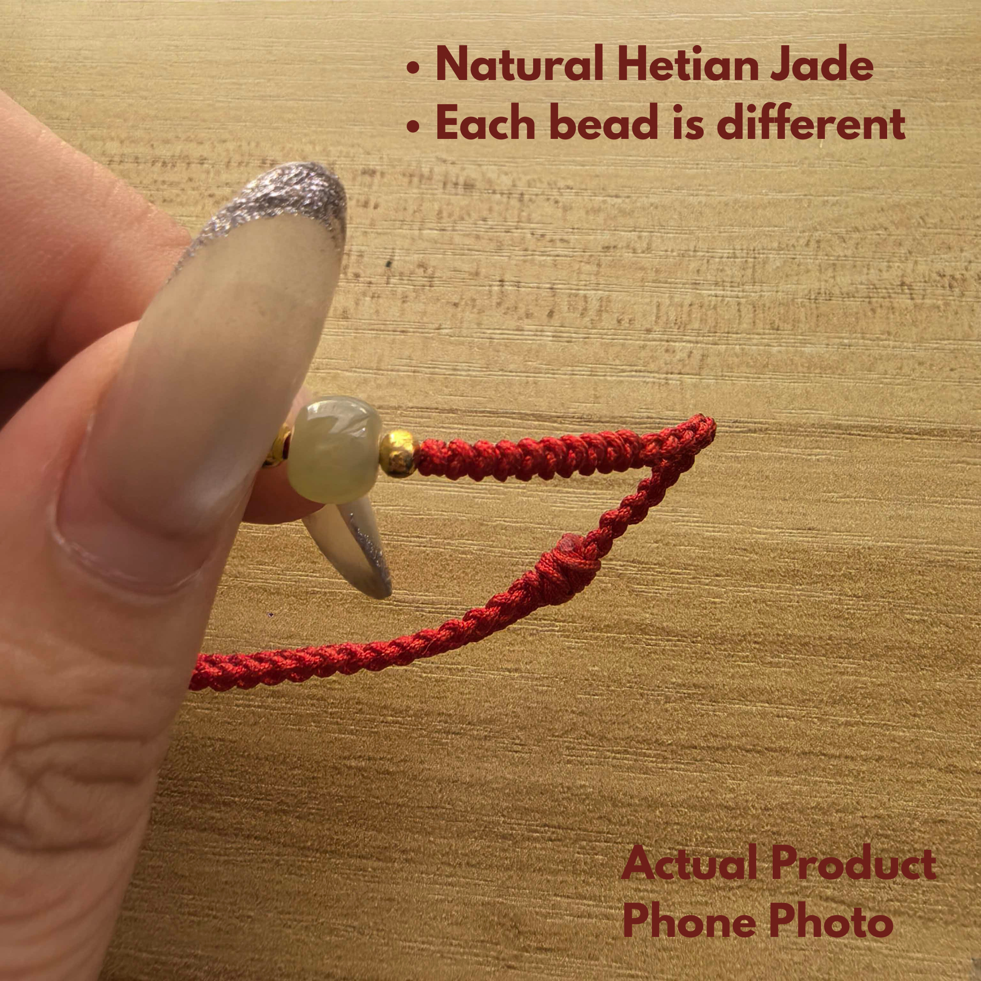 Close-up of green Hetian jade bead on handmade red string bracelet