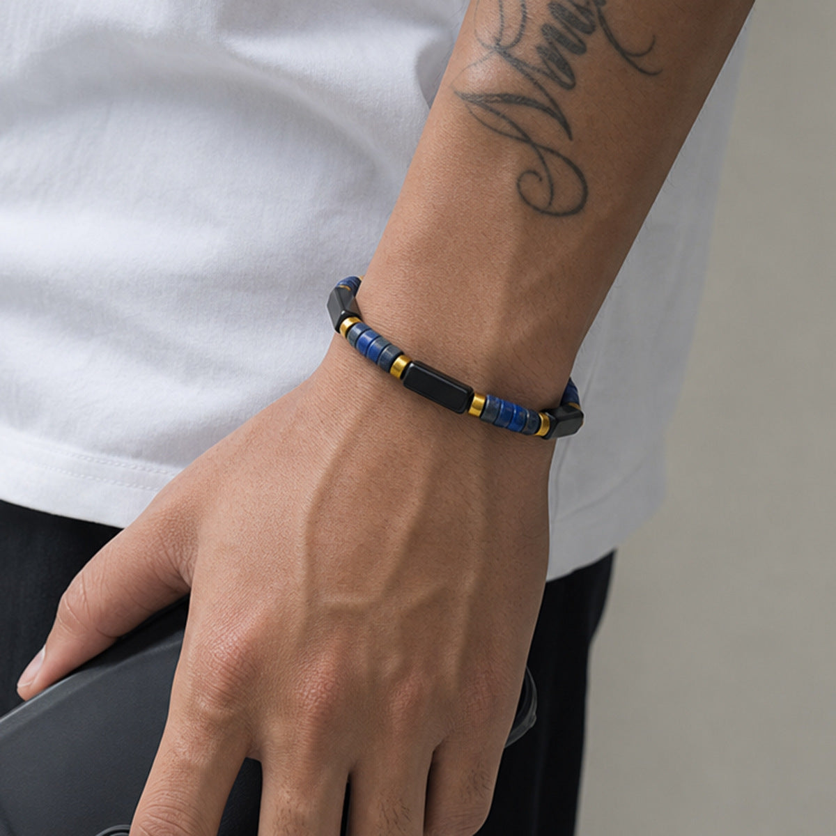 Man Wearing Lapis Lazuli and Black Obsidian Bracelet