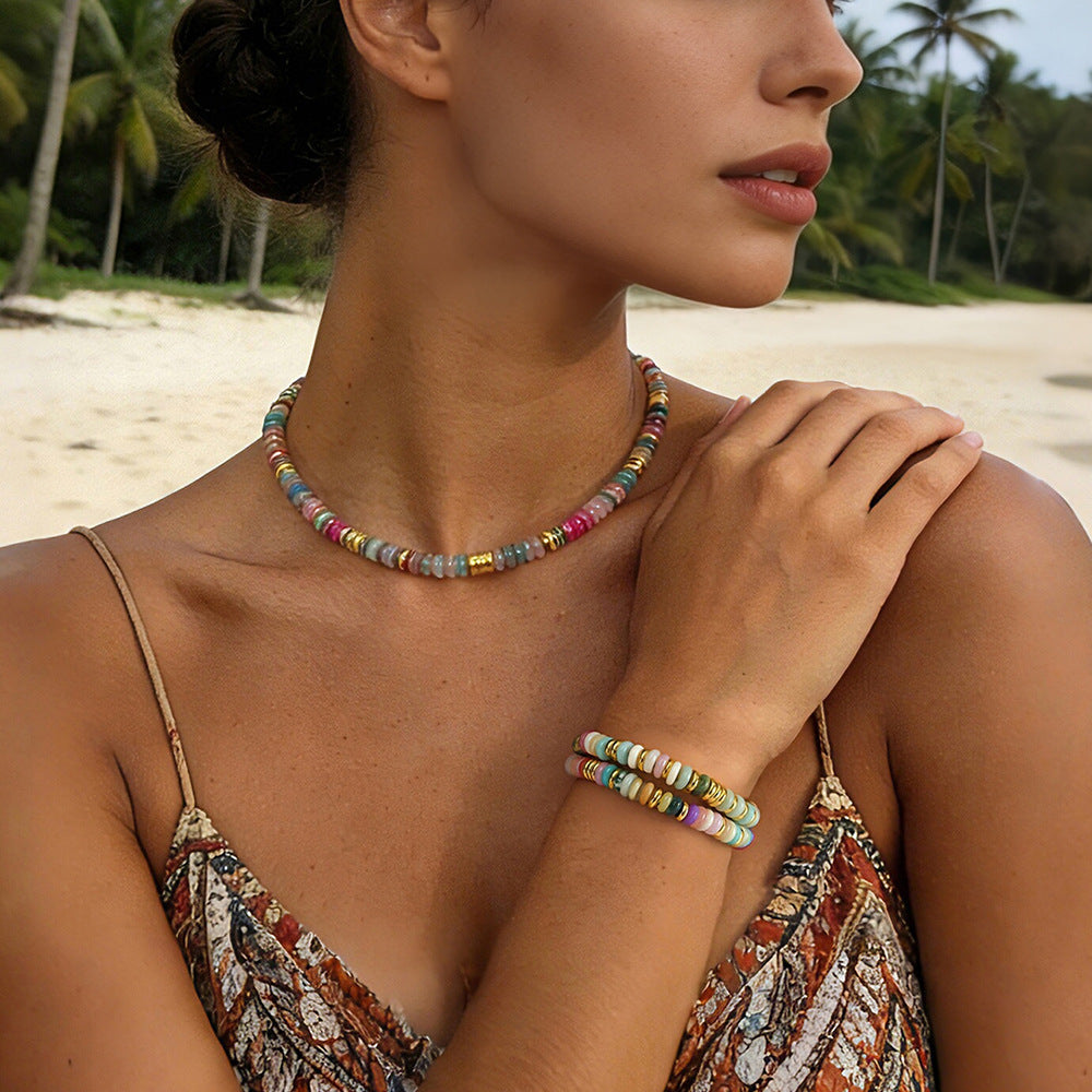 Woman wearing a natural 7 chakra gemstone bracelet