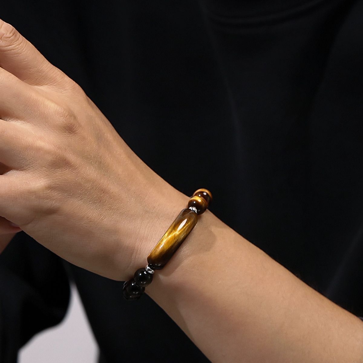 Man Wearing Natural Golden Obsidian and Tiger Eye Bracelet with 10mm Beads