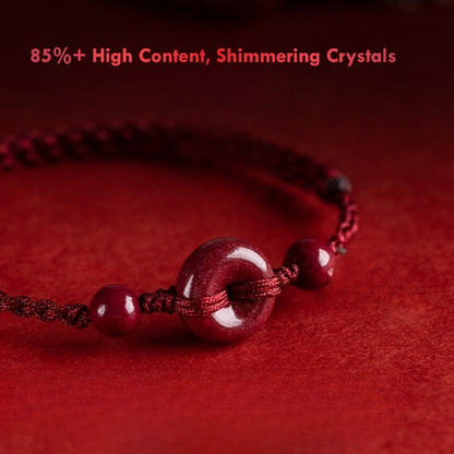 Close-up of cinnabar donut bead on handmade red string bracelet