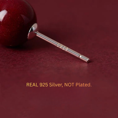 red gemstone earrings in sterling silver