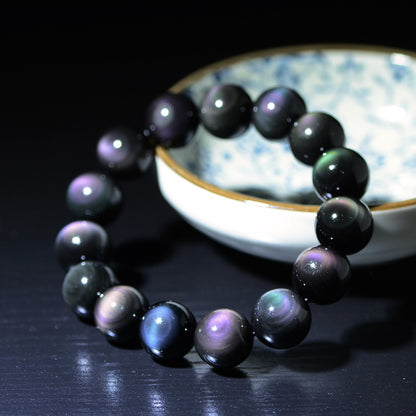 Natural Rainbow Eye Black Obsidian Bracelet showing iridescent rainbow reflection on polished obsidian beads