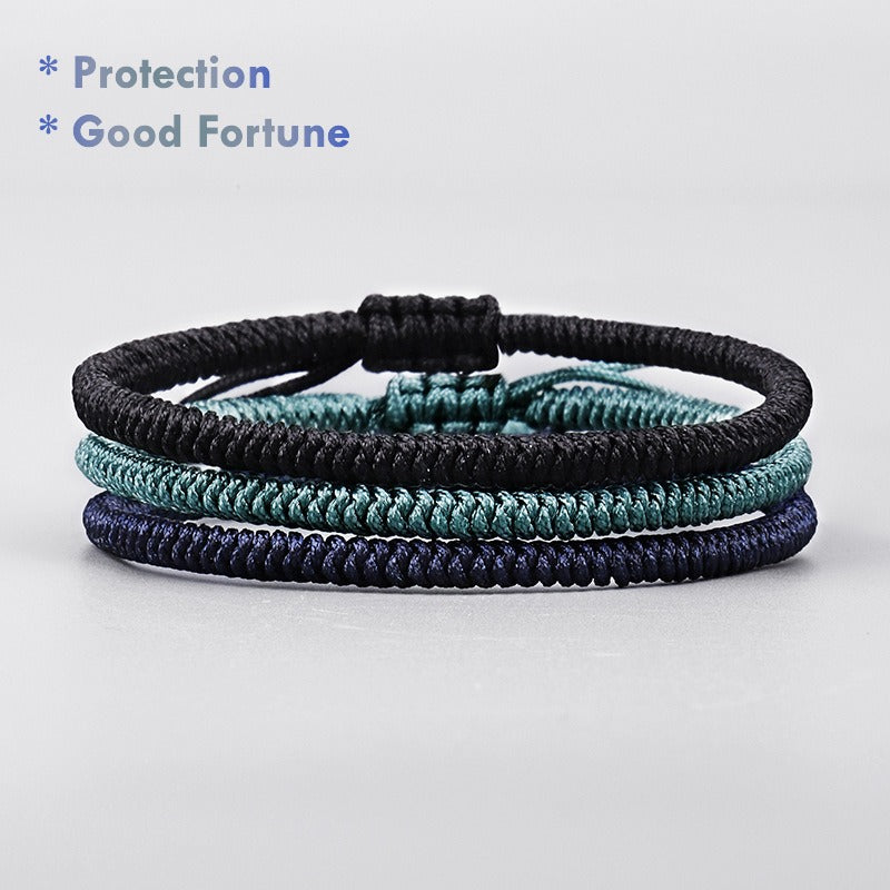 Handmade Tibetan triple-color protection bracelet — green black blue cord