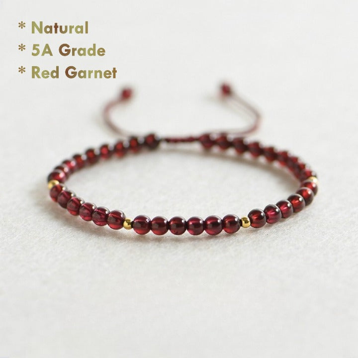 Natural red garnet bracelet with golden beads on red string