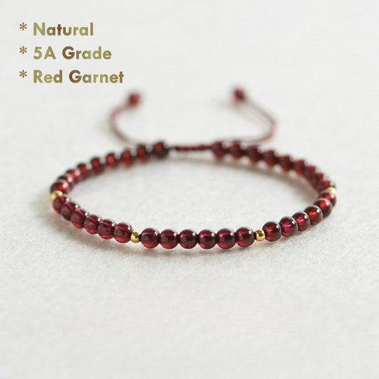 Natural red garnet bracelet with golden beads on red string